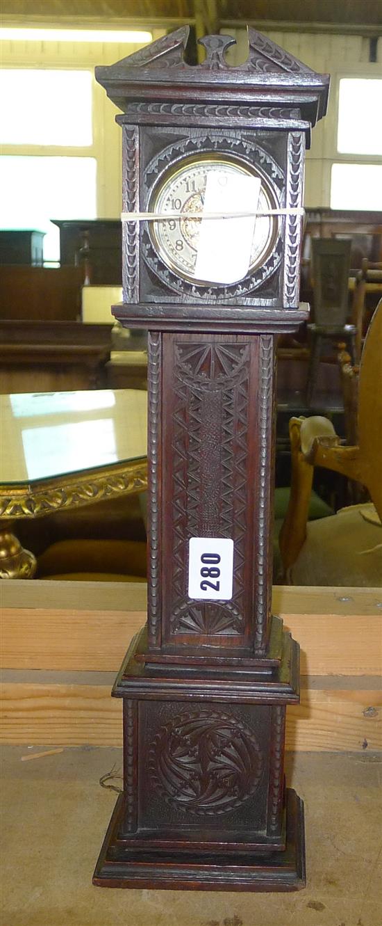 Chip carved model of longcase clock